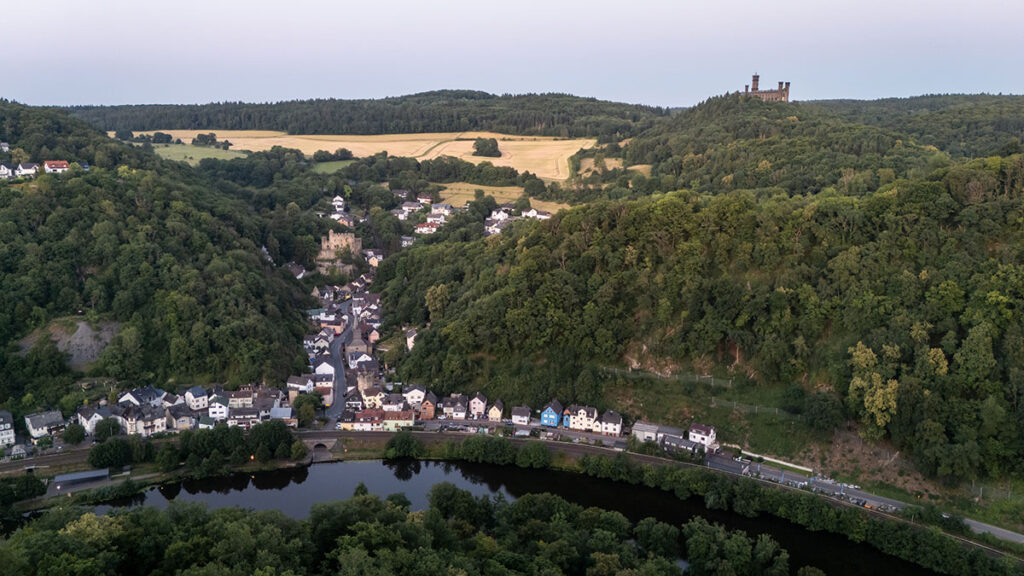 Drone photo of Balduinstein with historic houses, Balduinstein Castle, Schaumburg and the Lahn River in soft ligh