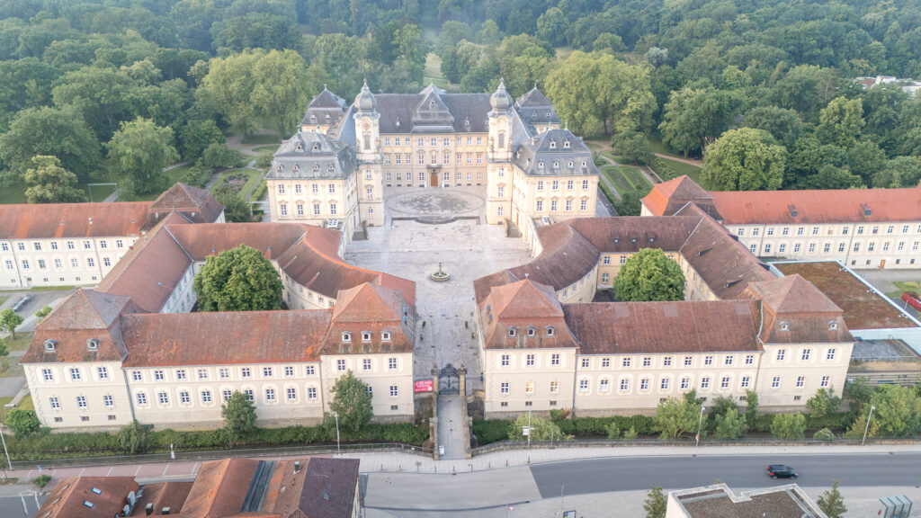 Aerial view of the symmetrical baroque courtyard of Werneck Palace in Lower Franconia, Bavaria, Germany